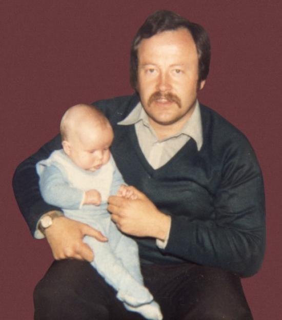Headline: VICTIM
Caption: Pride and joy...Barry on his dad's knee
Early picture of William Beggs murder victim Barry Wallace with his father.