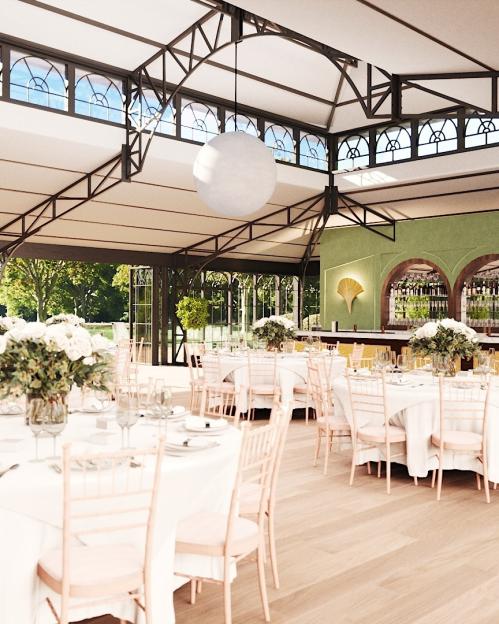 Wedding reception in a glass-roofed venue.