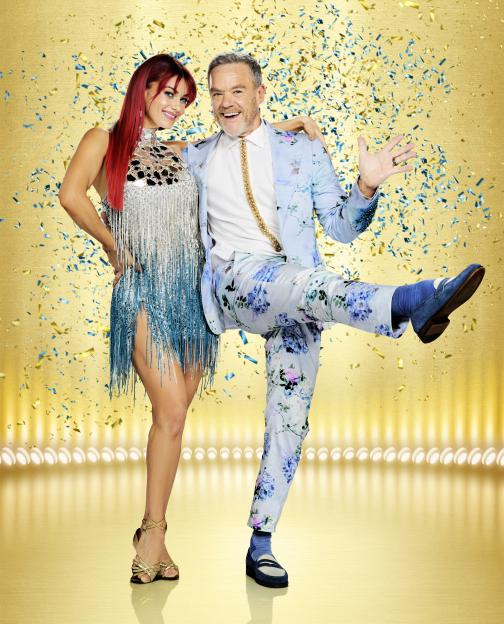 Dianne Buswell and Stefan Dennis smiling and posing.