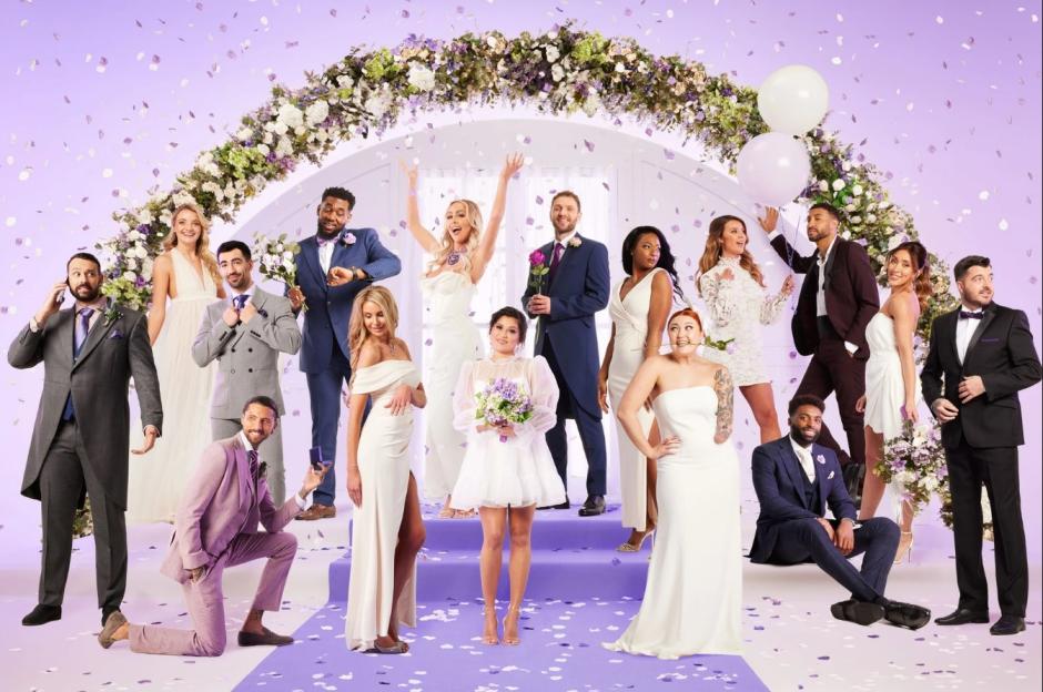 The 2023 cast of Married at First Sight, posing in wedding attire under a floral archway with falling confetti.