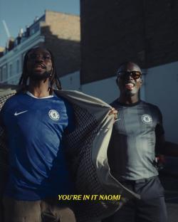 Two men in Chelsea football jerseys.