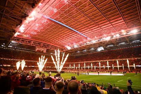 Fireworks and flame effects at a rugby match.