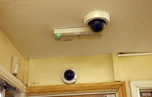 Security cameras and emergency light in a building.