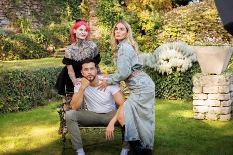 Holly, Aaron, and Naomi posing outdoors.