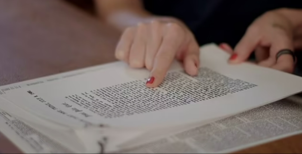 Mel C reviewing family documents.