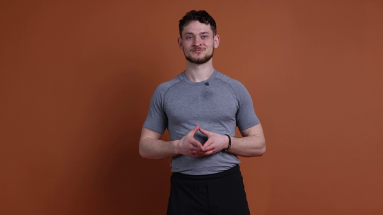 Man in gray shirt demonstrating exercises.
