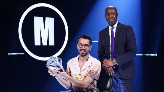 John Robinson, the winner of Mastermind 2025, holding his trophy.