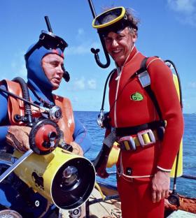 David Attenborough and a crew member preparing for an underwater filming.