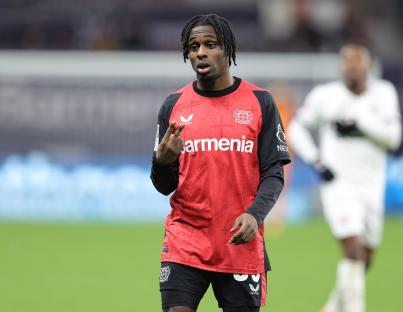 Jeremie Frimpong of Bayer Leverkusen makes a gesture during a Bundesliga match.