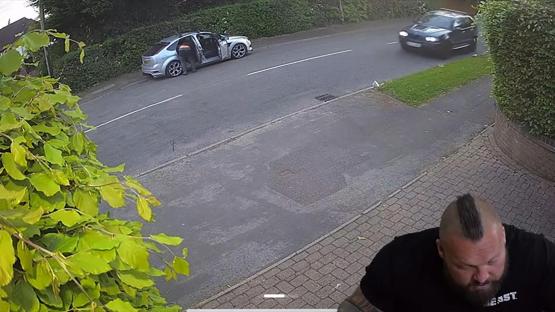 Security camera footage of Eddie Hall outside his house.