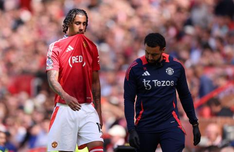 Leny Yoro of Manchester United leaves the field with an injury.