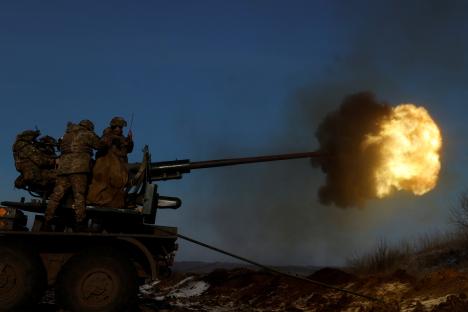 Ukrainian soldiers firing an anti-aircraft weapon in Bakhmut.