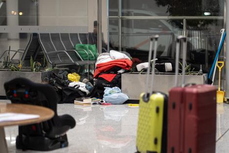 Homeless people's belongings at an airport.