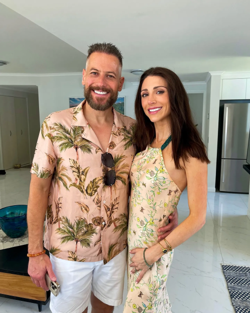 Couple smiling for a photo.