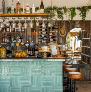 Beach bar with teal tile back bar.
