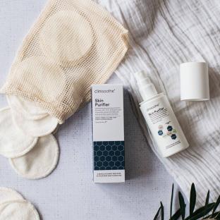 Clinisoothe Skin Purifier bottle and reusable cotton rounds.