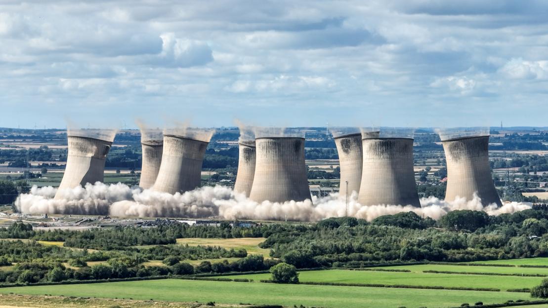 Moment eight 375ft-tall cooling towers crash to ground in record-breaking simultaneous demolition