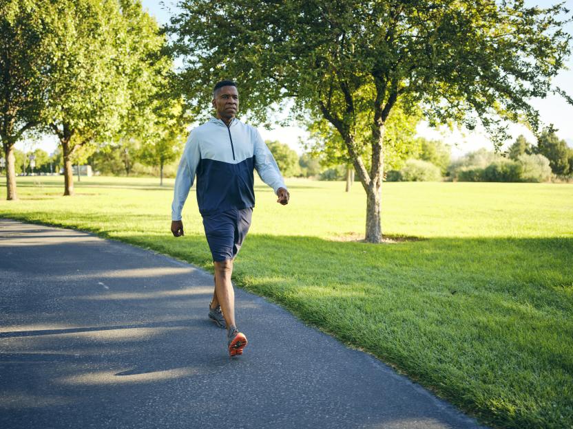 Mature Black man exercising in a park.