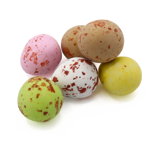 Five speckled chocolate Easter eggs in pastel colors.