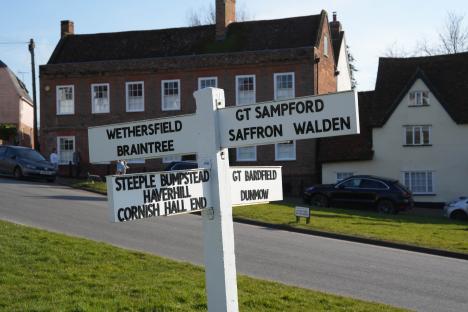 Directional signpost showing nearby villages.