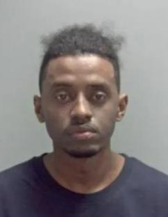 Mugshot of an asylum seeker convicted of rape.