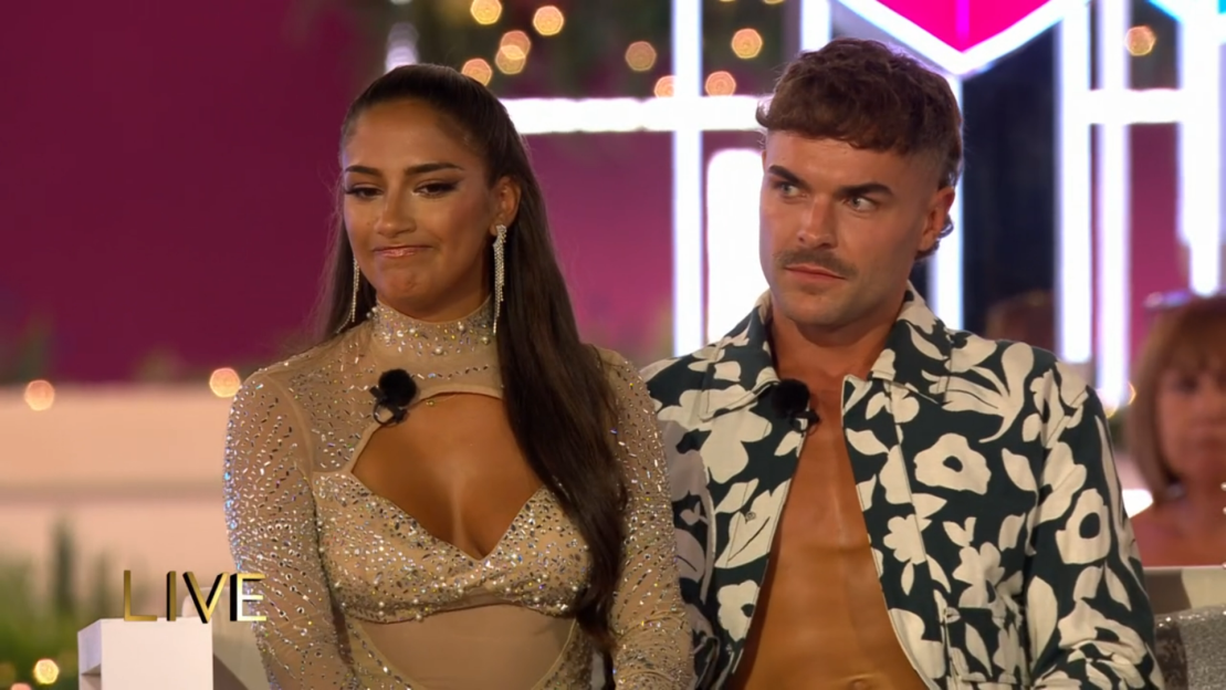Screenshot of a man and woman on a reality TV show.