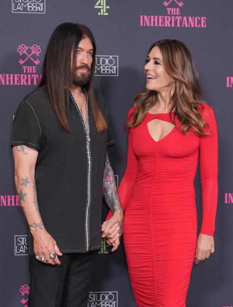 Billy Ray Cyrus and Elizabeth Hurley at the premiere of Channel 4's *The Inheritance*.