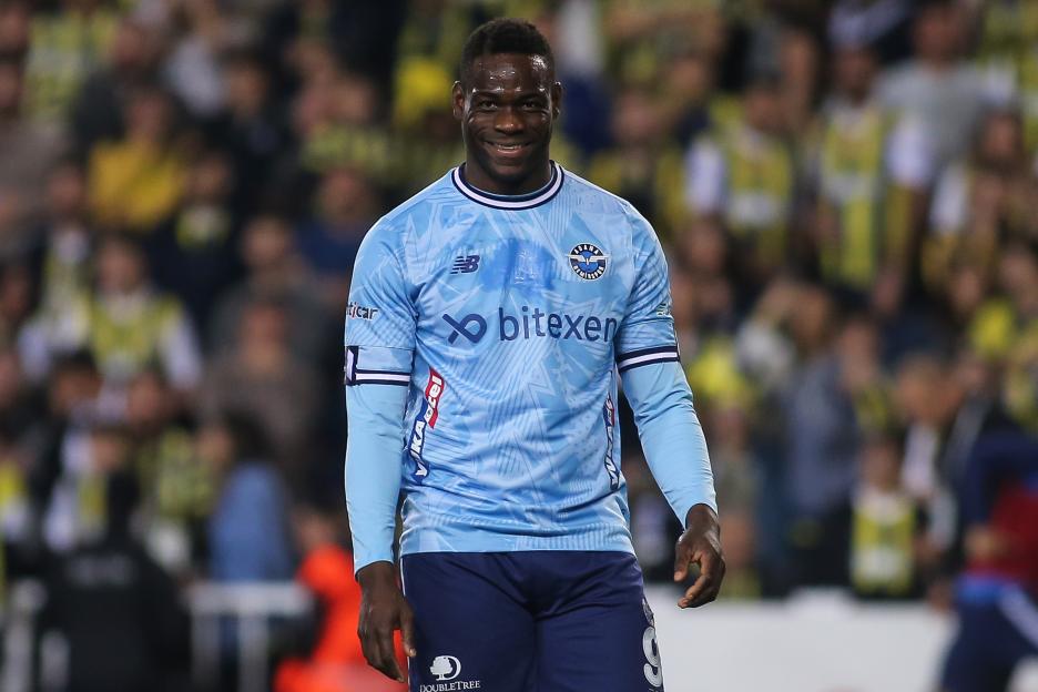 Mario Balotelli of Adana Demirspor smiling during a soccer match.
