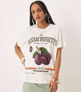 Woman wearing a white t-shirt with a vintage plum illustration.