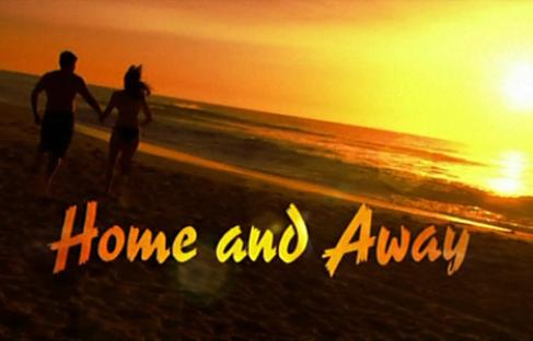 Home and Away logo with a couple walking on the beach at sunset.