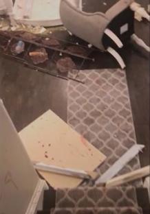 Debris on the floor after an apparent accident; text overlay reads