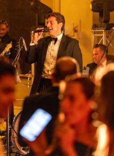 James Argent performing at a charity event.