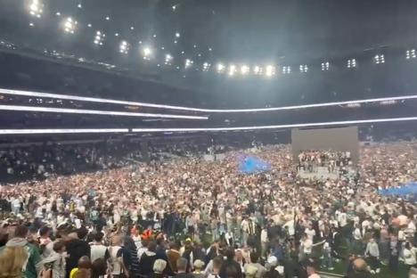 Wild moment Spurs fans storm pitch in huge invasion of Tottenham Stadium after lifting silverware in Bilbao