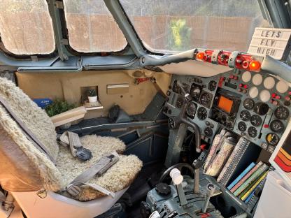 Interior of a converted 1970s Hawker jet, now a tiny home.