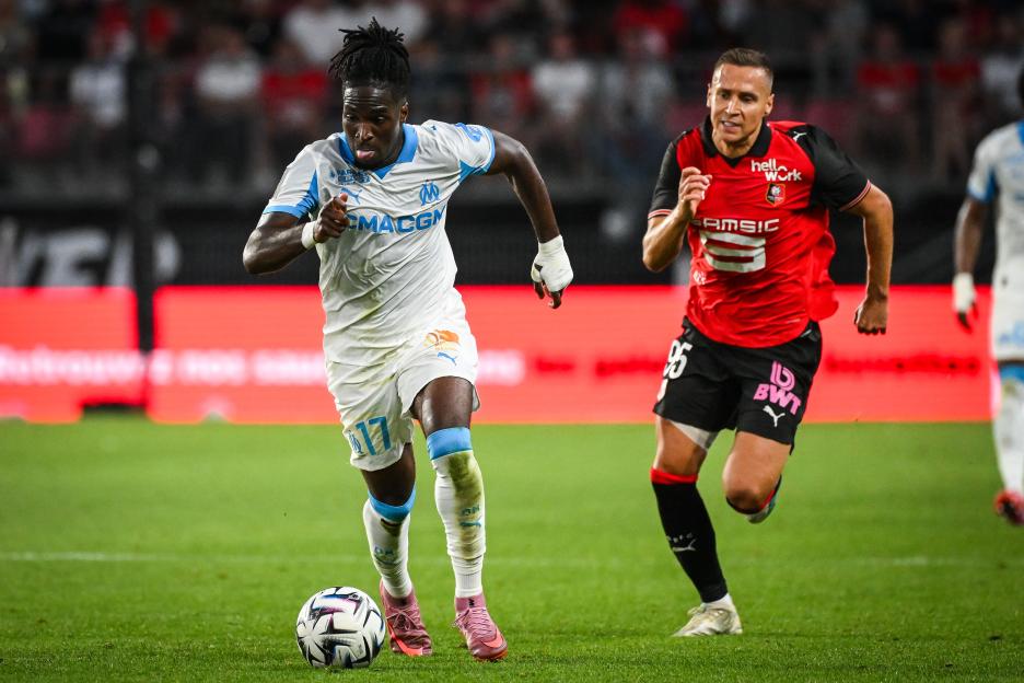 Jonathan Rowe of Marseille and Przemyslaw Frankowski of Rennes during a soccer match.