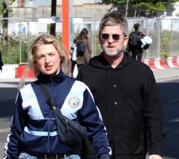 Noel Gallagher and his daughter Anais walking near Wembley Stadium.