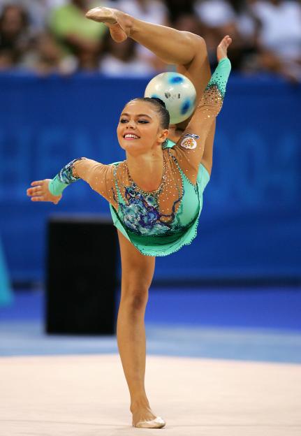 Alina Kabaeva of Russia performing rhythmic gymnastics with a ball at the 2004 Olympic Games.