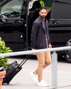 Ruben Amorim, Manchester United manager, leaving a hotel with a suitcase.