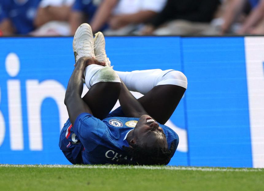 Chelsea's Trevoh Chalobah in pain on the field after an injury.