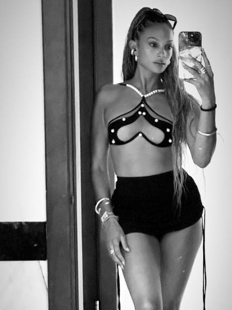 Black and white photo of Alesha Dixon taking a selfie.