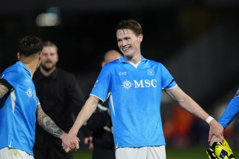 Scott McTominay of Napoli celebrates with a teammate after a soccer match.