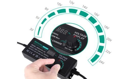 Adjustable 100V-240V AC/DC converter with LED voltage display.