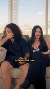 Marc Cucurella and Claudia Rodriguez sitting on a couch, he wipes away tears.