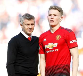 Ole Gunnar Solskjaer and Scott McTominay after a Premier League match.