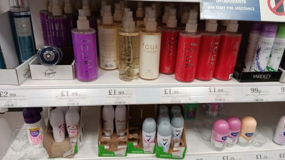 Home Bargains store shelf displaying various fragrances and deodorants.