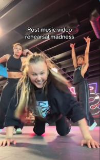 JoJo Siwa and dancers rehearsing a music video.
