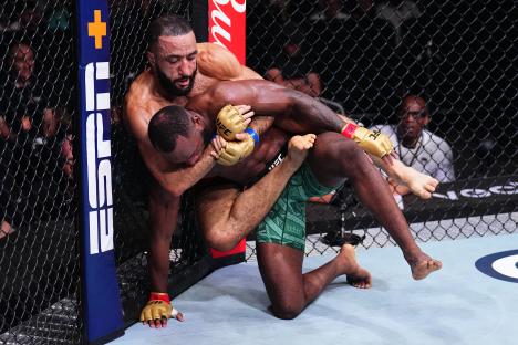 Belal Muhammad attempting a submission on Leon Edwards in a UFC welterweight championship bout.