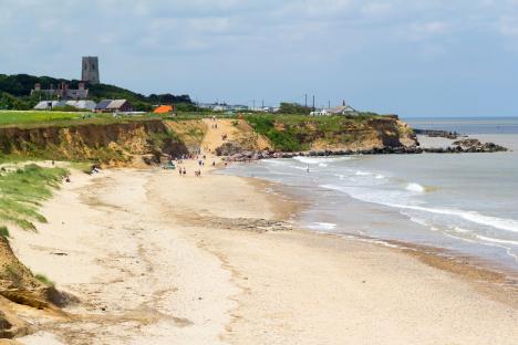 Pretty English seaside village with secluded beach that could disappear in 25 years