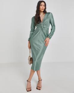 Model wearing a green midi dress with a twist front.