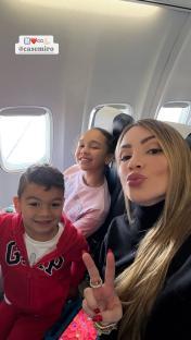 Casemiro's wife and children on a plane.